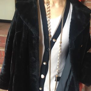 Long chain pearl necklace.